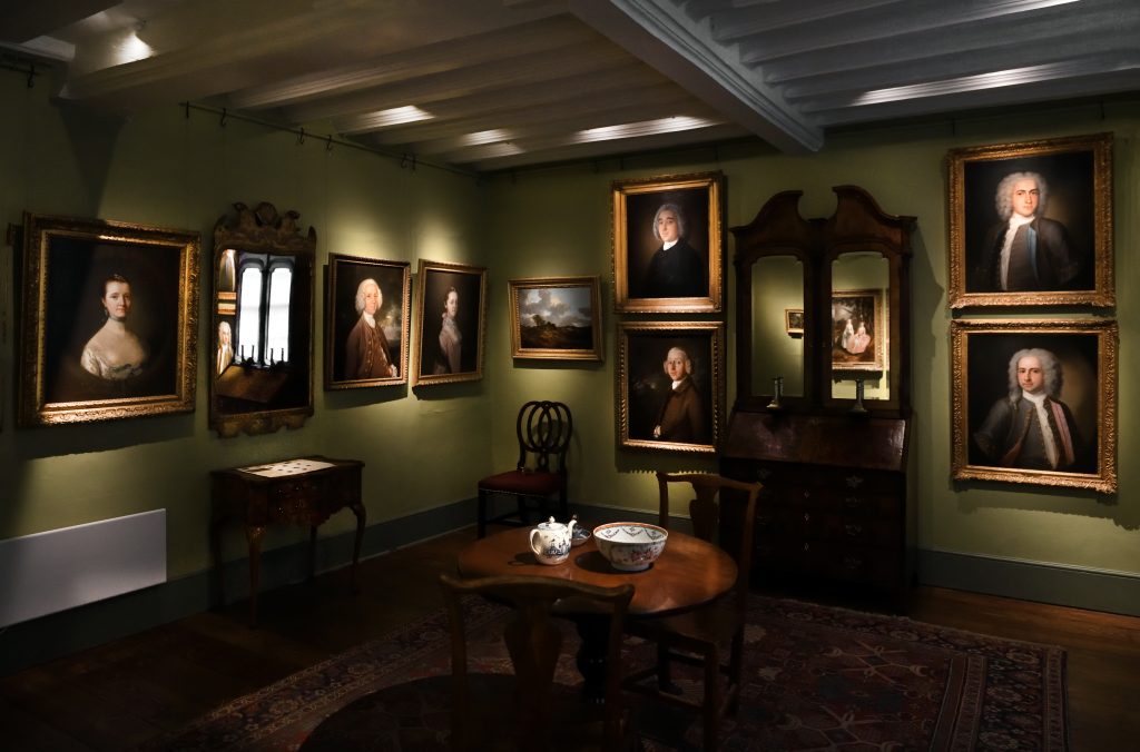 An image of the Parlour in Gainsborough's House. Inside are Gainsborough's early portraits along with furniture from the era.