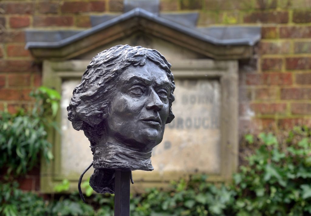 An image of the Thomas Gainsborough bronze bust in the garden. The bust is in front of the plaque.