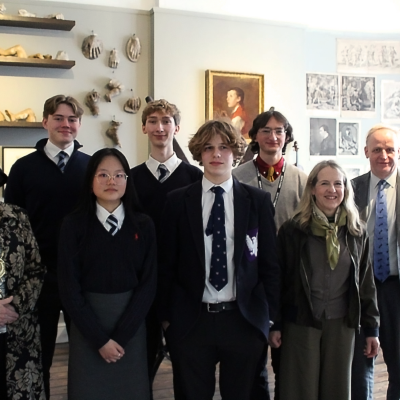 An image of all 5 student contestants. Pictured with the Mayor of Sudbury, Events Co-ordinator and Director of Gainsborough's House. They are all stood in the Finnis Scott Drawing Room.