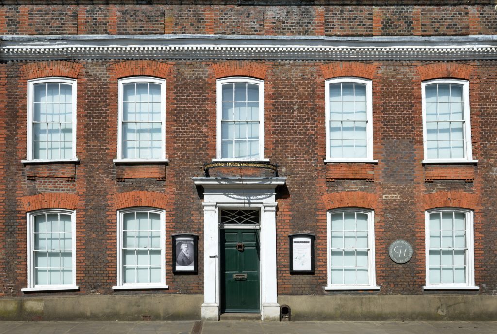 A picture of the front of the old House, Gainsborough's House. There is a red-brick façade and white georgian windows.