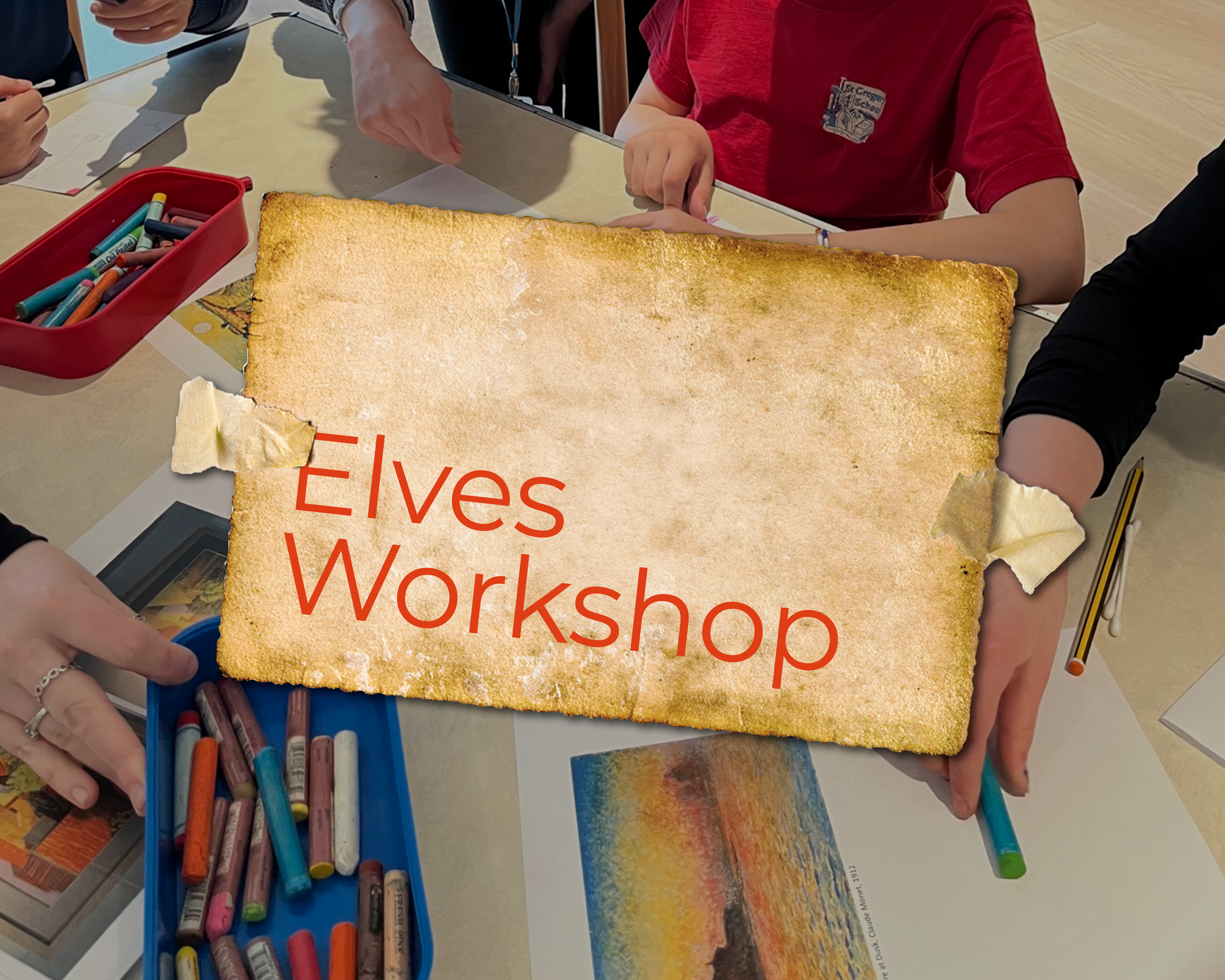 An image of young people drawing with pastels. Overlayed is a piece of paper with the words 'Elves Workshop' on it.