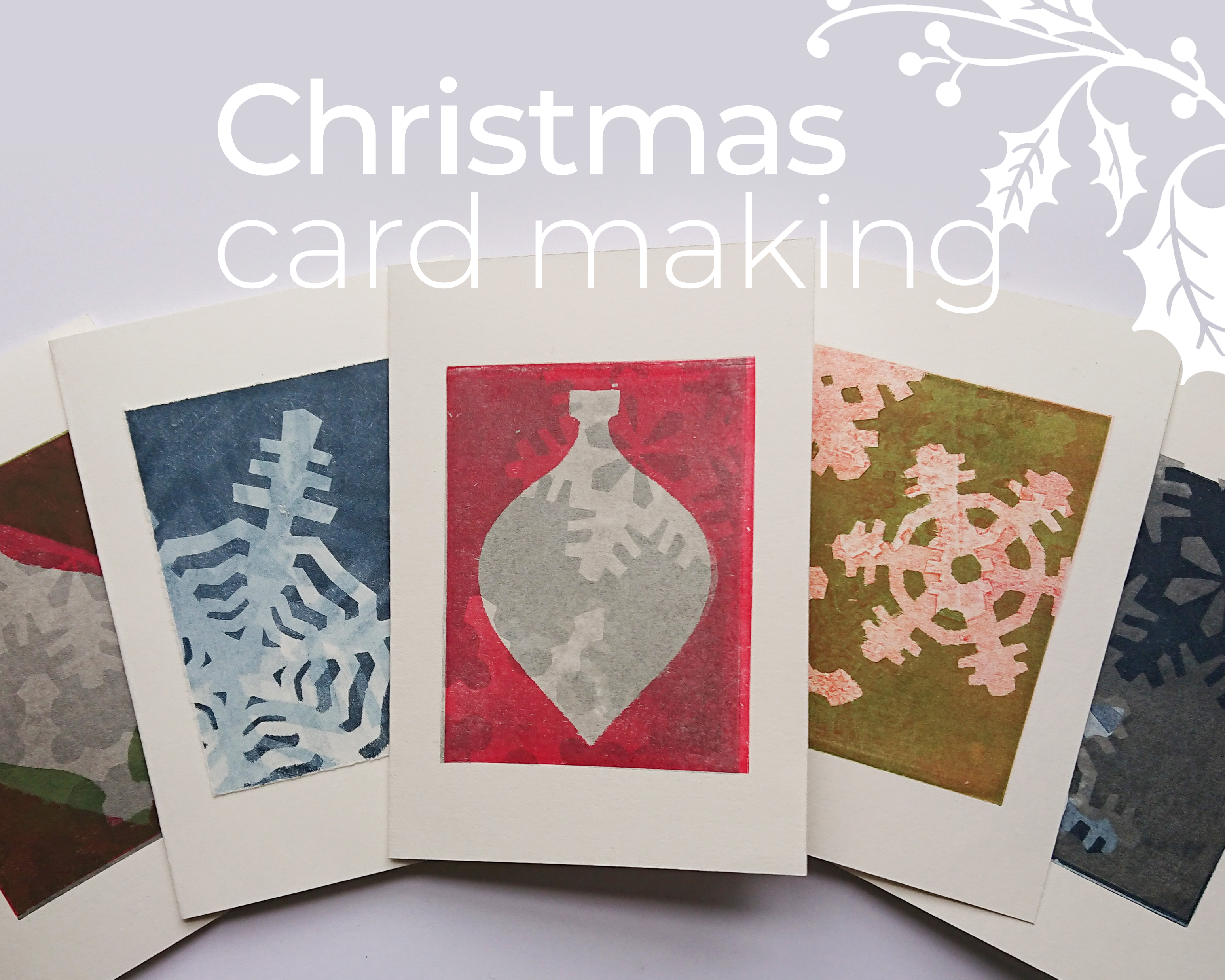 An image of handmade Lino-print Christmas cards. The main colours are blue, green and red. There is overlayed text which reads: Christmas card making.