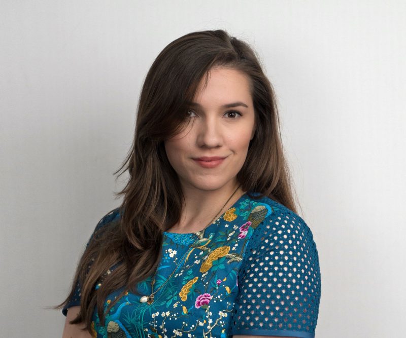 An image of author Serena Dyer. A white woman with long brown hair wearing a blue blouse. 
