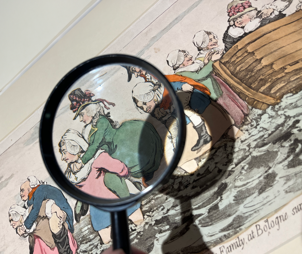 An image of a magnifying glass hovering over a Bunbury print.