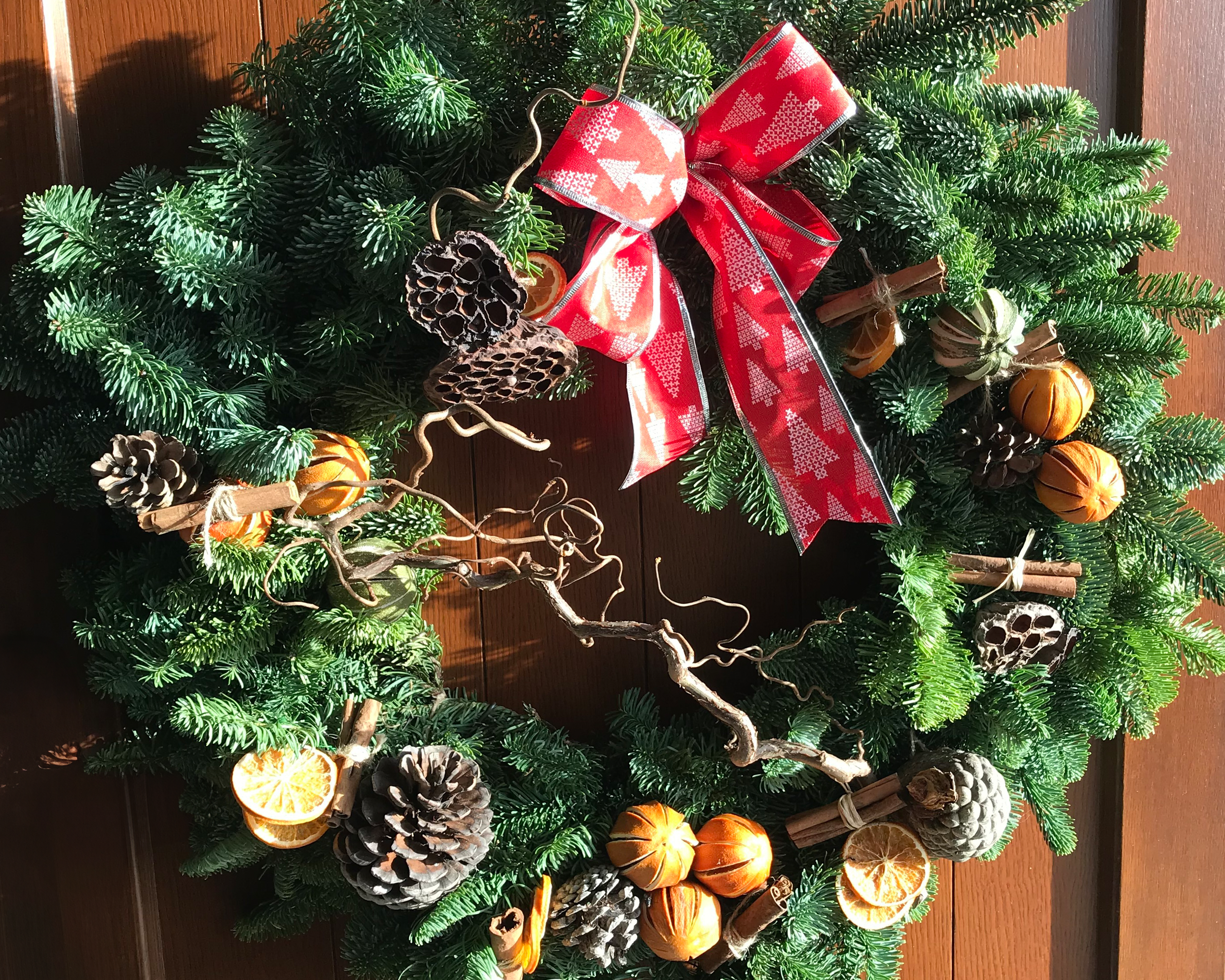 An image of a Christmas wreath made by Just Anne Flowers.